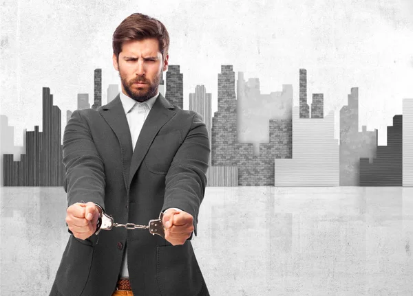 Happy businessman with handcuffs — Stock Photo, Image