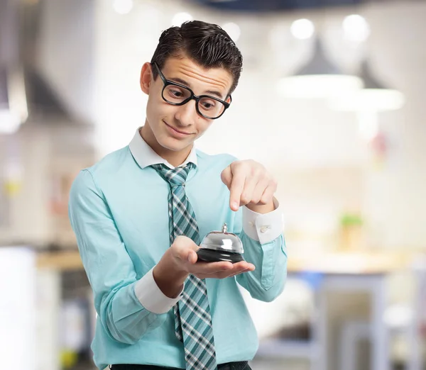 Happy businessman with ring bell — Stock Photo, Image