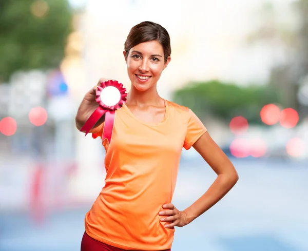 Strong sport woman with medal — Stock Photo, Image