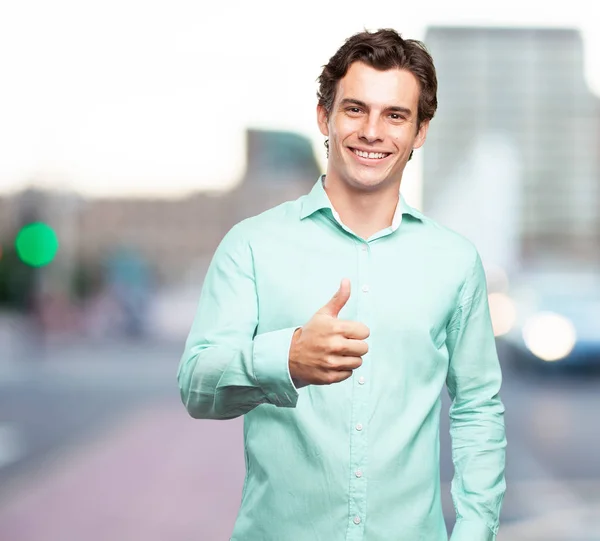 Joven feliz con signo de bien — Foto de Stock