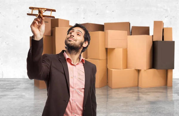 Happy businessman with plane — Stock Photo, Image