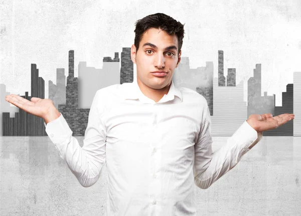 Happy young man in confused pose — Stock Photo, Image