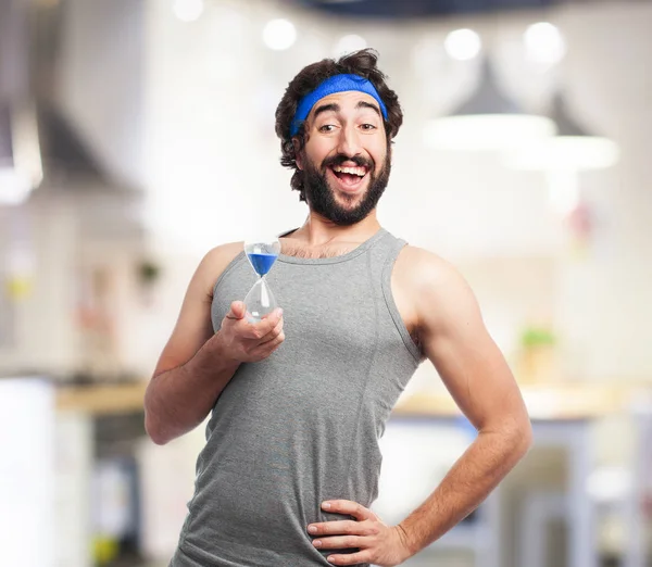 Happy sport man with sand timer — Stock Photo, Image