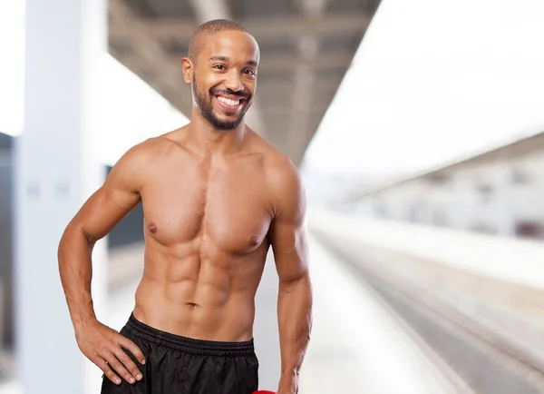 Happy black man in strong pose — Stock Photo, Image