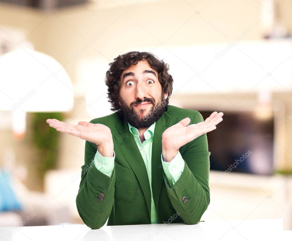 confused businessman sitting at table