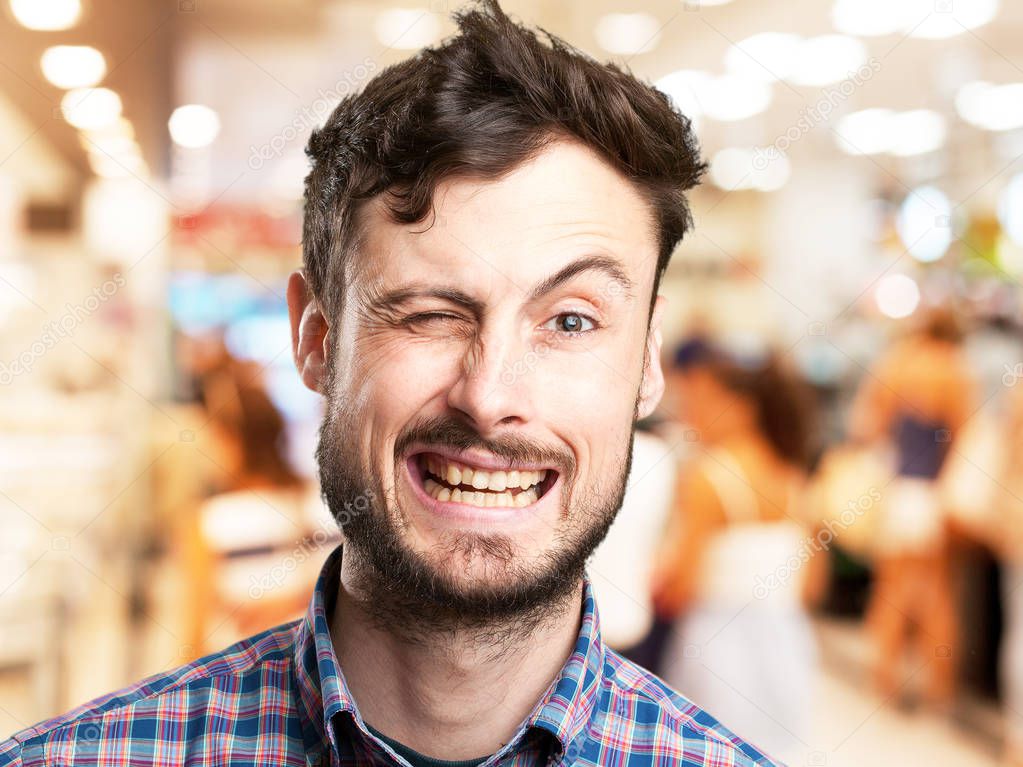 crazy young man wink gesture