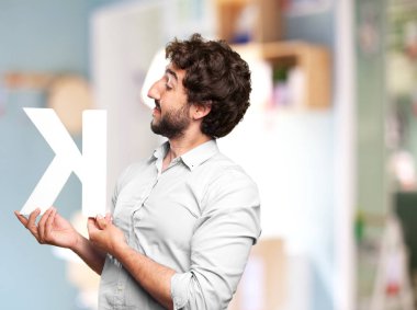 crazy man with a letter K