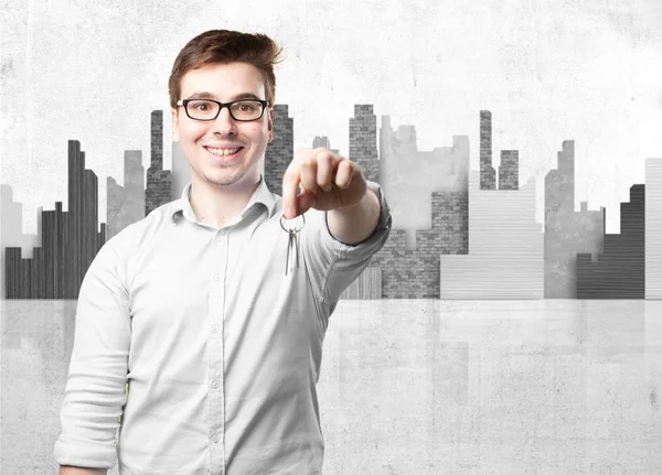 Happy young man with key — Stock Photo, Image