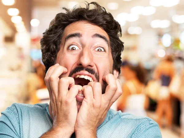 Crazy young man in scared pose — Stock Photo, Image