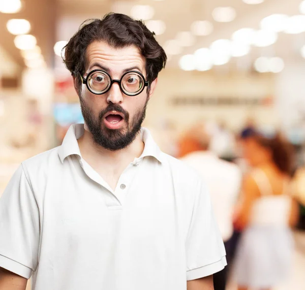 Crazy young man in surprised pose — Stock Photo, Image