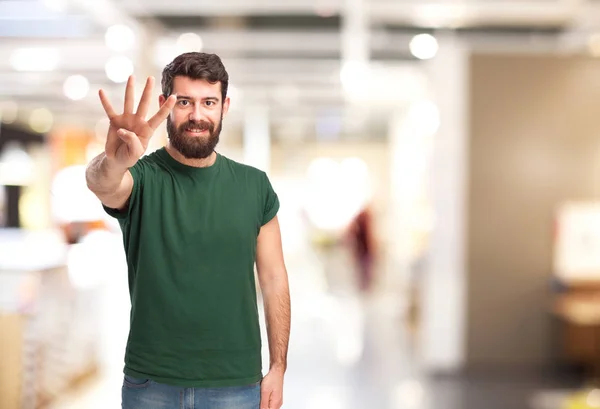 Gelukkig man met nummer vier teken — Stockfoto