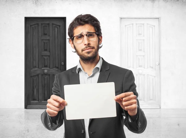 Happy businessman with placard — Stock Photo, Image