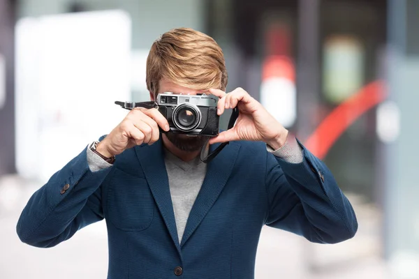 Gelukkig zakenman met camera — Stockfoto