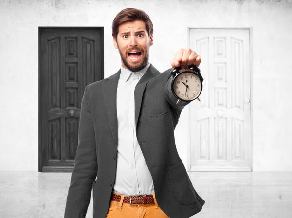 Worried businessman with clock — Stock Photo, Image