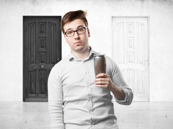 Young man with beer in celebrating pose — Stock Photo, Image