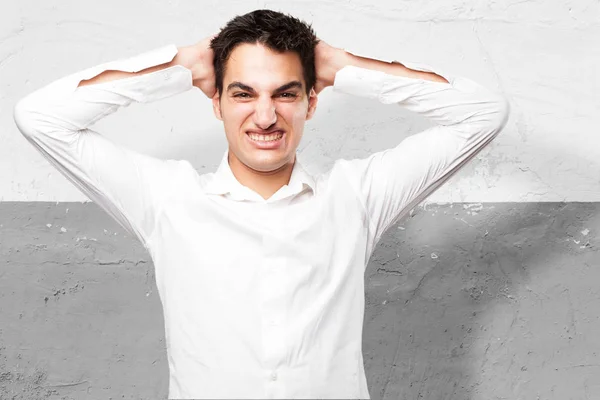 Angry young man in crazy pose — Stock Photo, Image