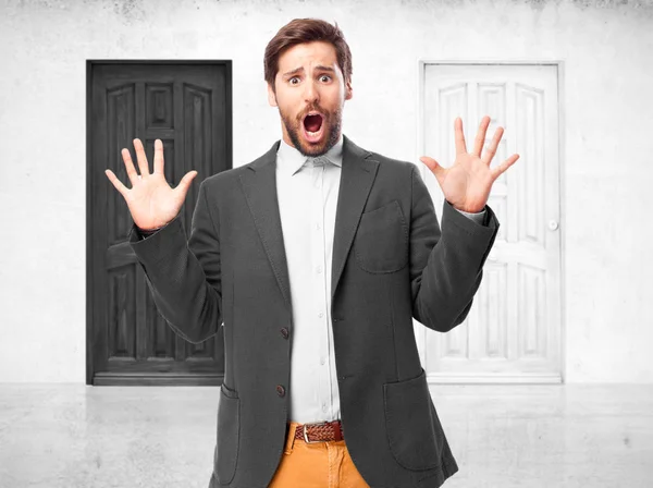 Scared businessman in frightened pose — Stock Photo, Image
