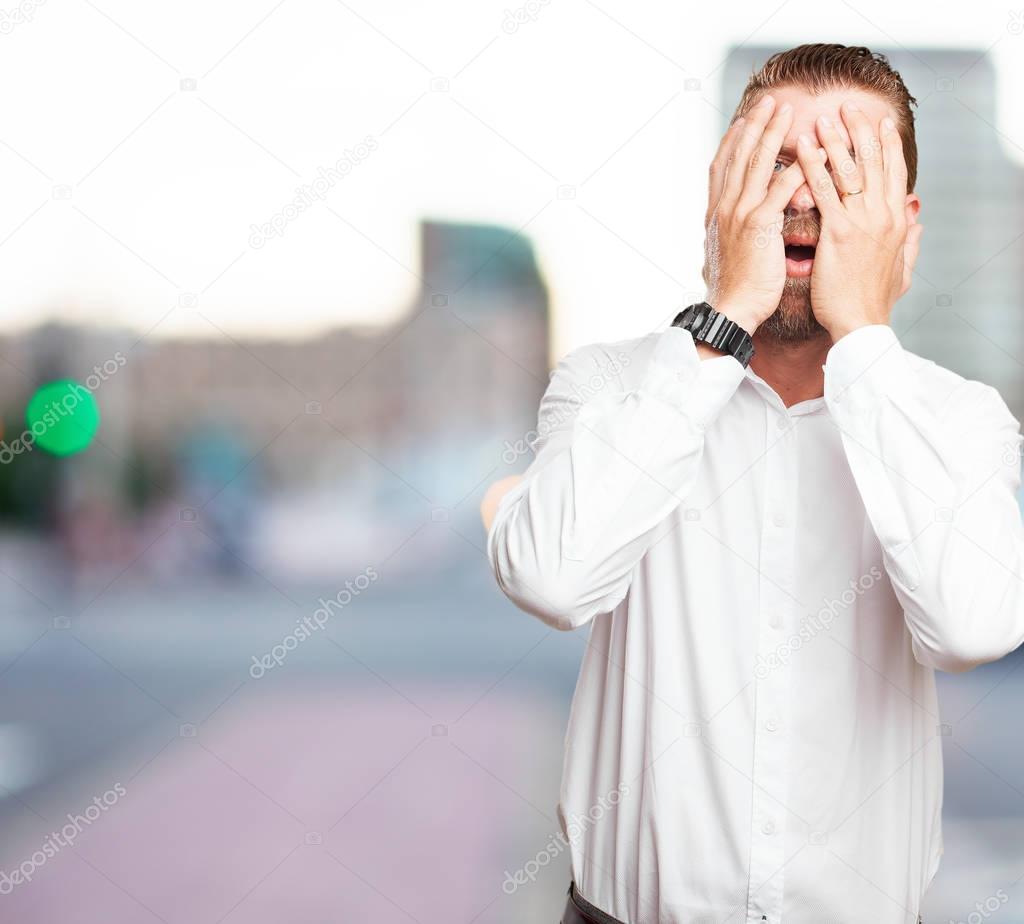 worried young man covering face 