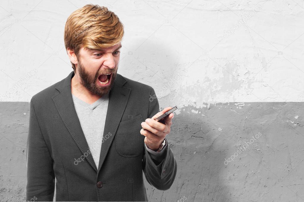 angry businessman with mobile phone