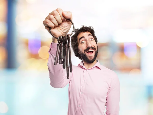 Crazy young man with vintage key — Stock Photo, Image