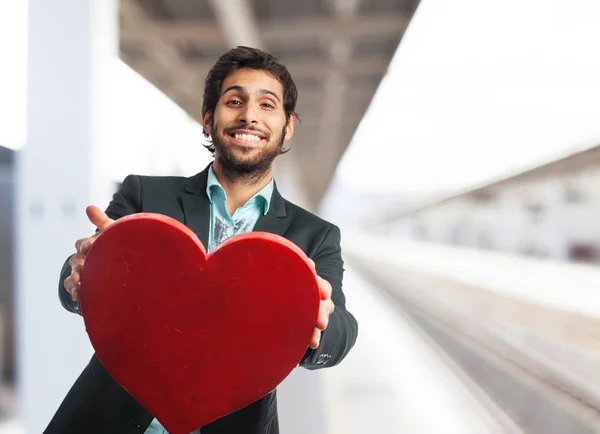 Homem de negócios feliz com símbolo de coração — Fotografia de Stock