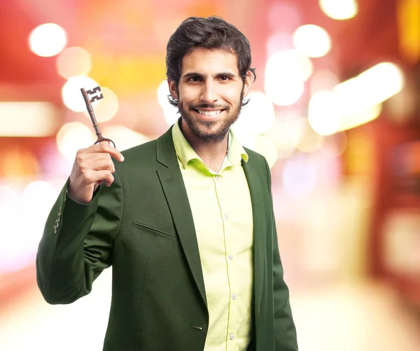 Homme d'affaires indien avec une clé — Photo