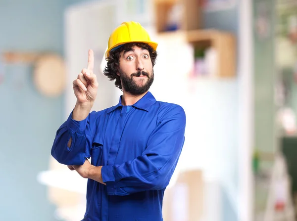 Trabajador hombre mostrando número uno signo — Foto de Stock