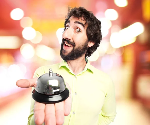 Happy young man with ring bell — Stock Photo, Image