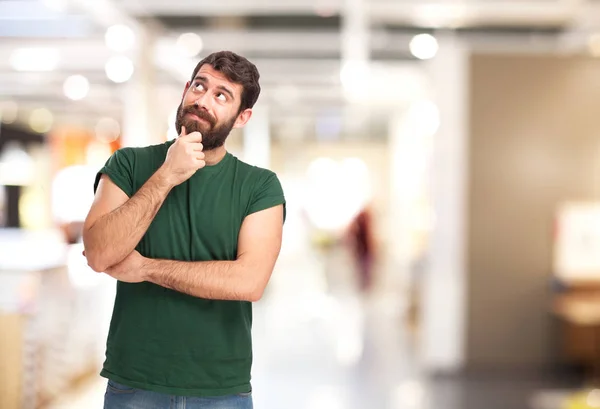 Gelukkig jonge man denkt — Stockfoto