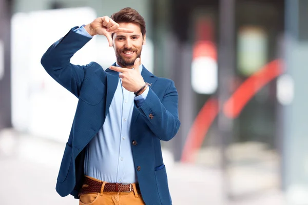 Hombre de negocios feliz con marco signo — Foto de Stock