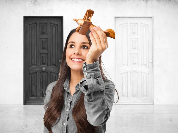 Happy young woman with plane — Stock Photo, Image