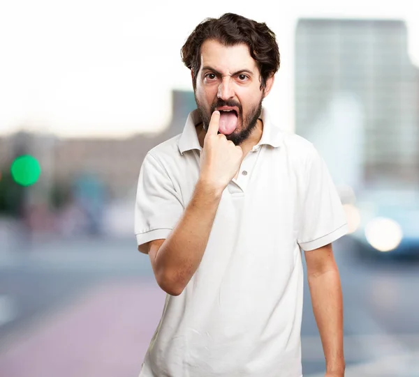 Jeune homme en colère avec signe vomi — Photo