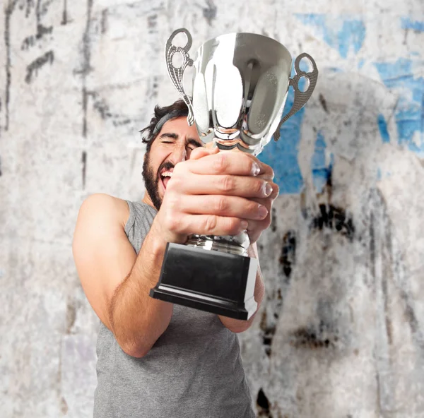 Orgulloso joven con copa deportiva —  Fotos de Stock