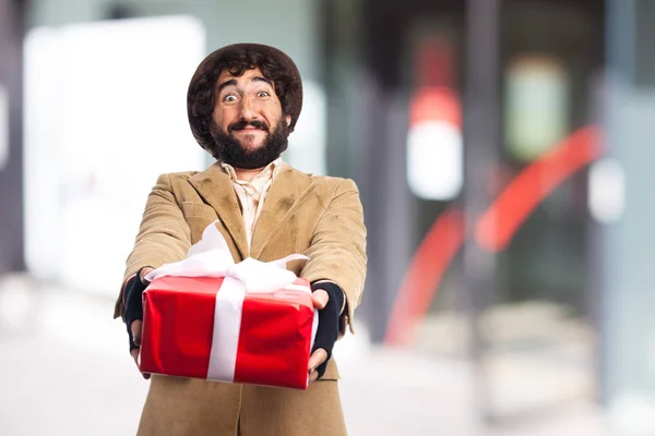 Happy young man with gift — Stock Photo, Image