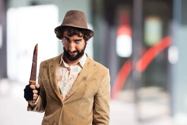 Angry young man with knife — Stock Photo, Image