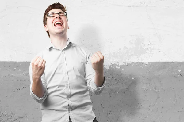 Happy young man with celebrating sign — Stock Photo, Image