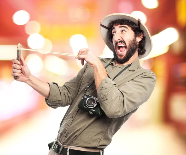 Crazy explorer man with slingshot — Stock Photo, Image