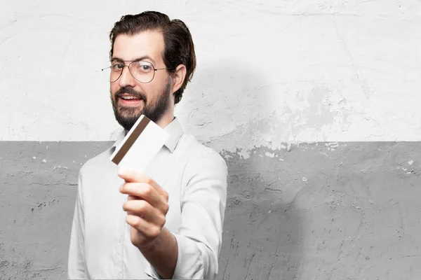 Happy young man with credit card — Stock Photo, Image