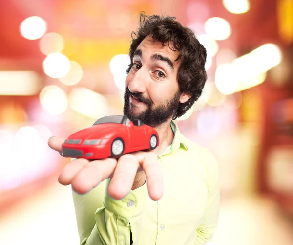 Felice giovane uomo con auto rossa — Foto Stock