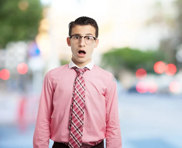 Stressed young man in surprised pose — Stock Photo, Image