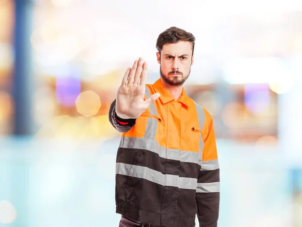 angry worker man with stop gesture