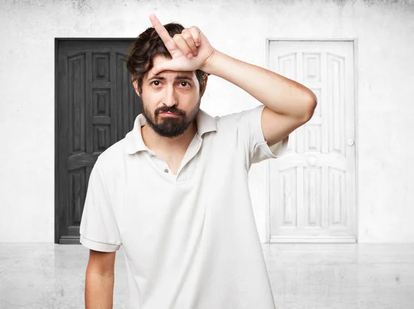 Angry young man with loser sign — Stock Photo, Image