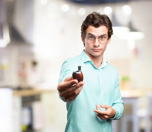 Happy young man with pipe — Stock Photo, Image