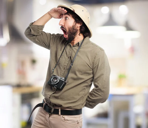 Crazy explorer man looking far sign — Stock Photo, Image