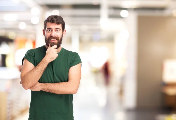 Glücklicher junger Mann denkt — Stockfoto