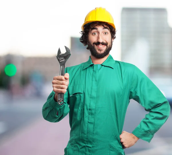 Hombre trabajador feliz con llave inglesa —  Fotos de Stock