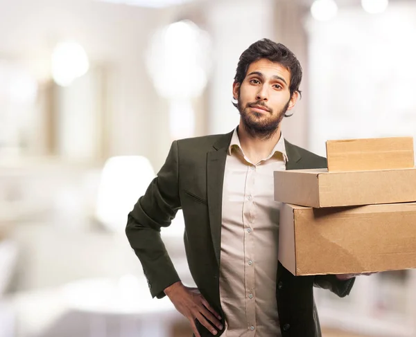 Happy businessman with boxes — Stock Photo, Image