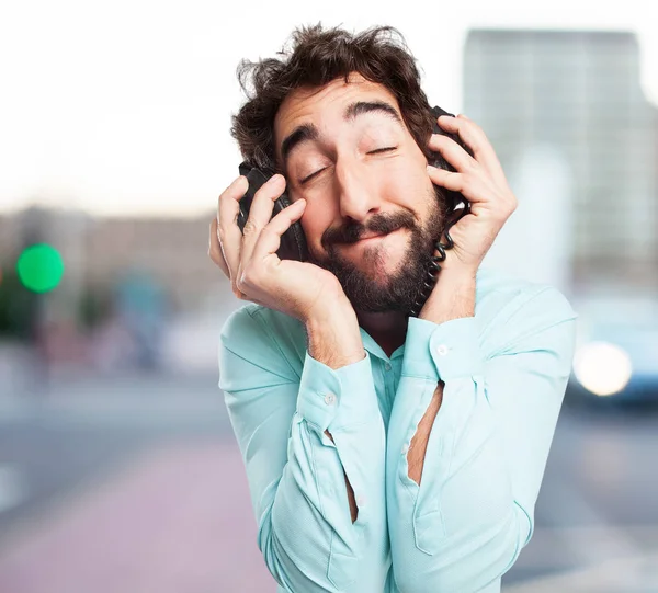 Joven feliz con auriculares —  Fotos de Stock