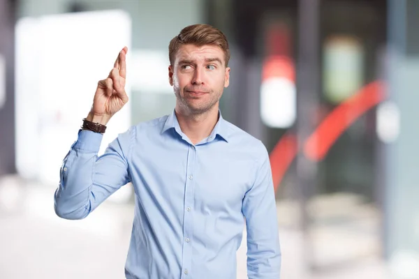 Angry businessman cross fingers — Stock Photo, Image