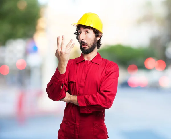 Trabalhador homem com número quatro sinal — Fotografia de Stock